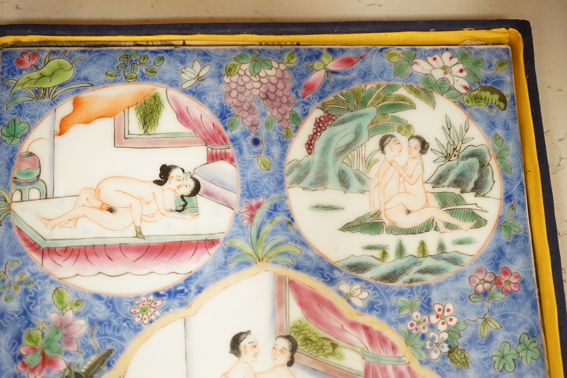A cased Chinese enamelled porcelain erotic tile, 25cm wide, 36.5cm high